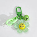 Smiley Face Daisy Flower Keychain: Green Grid / One Size